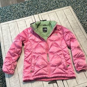 North Face girls puffer jacket size large shiney pink with green on the inside